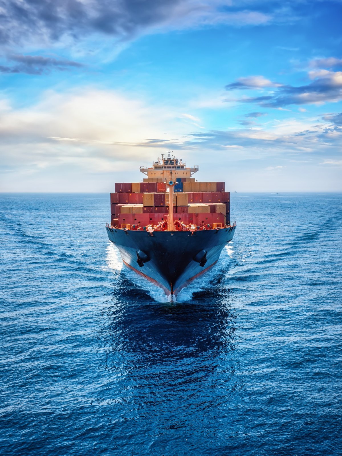 Loaded container cargo vessel navigating the ocean