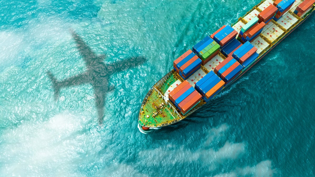Shipping port with containers stacked at sunrise
